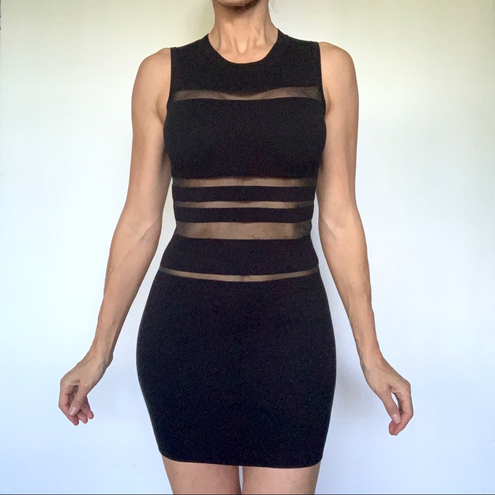 NEW Black Mini Dress with mesh. Amazing elastic fabric.